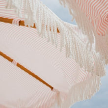 Business & Pleasure Co. Market Umbrella ~ 7' White Boho Fringe Outdoor Patio Umbrella, UPF 50+, 1.5" Wood Pole, 7’W x 8.5’H, Lauren's Pink Stripe
