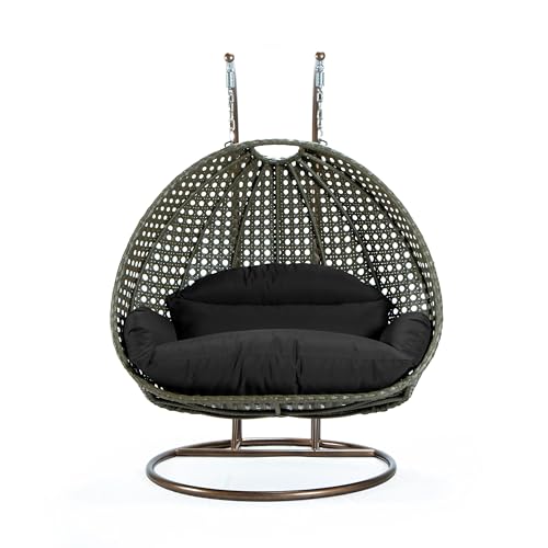 LeisureMod Black Wicker 2 Person Egg Swing Chair with Beige Stand and Cushions – Double Hanging Hammock Lounge for Patio, Indoor & Outdoor Use