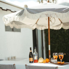 Business & Pleasure Co. Market Umbrella ~ 7' White Boho Fringe Outdoor Patio Umbrella, UPF 50+, 1.5" Wood Pole, 7’W x 8.5’H, Lauren's Navy Stripe