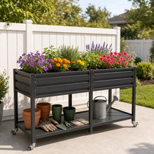 2-Tier Elevated Metal Wicking Garden Bed with Lockable Wheels & Storage Shelf, Dark Gray Staggered Self-Watering Planter. Built-in tank feeds plants via capillary action for veggies, herbs, flowers