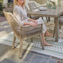 Signature Design by Ashley Beach Front Casual Outdoor Arm Chair with All-Weather Cushion, Set of 2, Resin Wicker with Aluminum Frame, 18.5" Seat Height, Beige