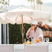 Business & Pleasure Co. Market Umbrella ~ 7' White Boho Fringe Outdoor Patio Umbrella, UPF 50+, 1.5" Wood Pole, 7’W x 8.5’H, Lauren's Pink Stripe