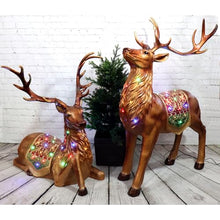 Fraser Hill Farm 5-Ft. Tall Standing Reindeer Holiday Figurine with Metallic Finish, Oversized Indoor or Outdoor Christmas Decoration with Long Lasting Multi-Color LED Lights