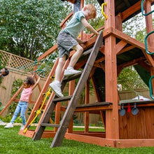 KidKraft Raptor Trail Wooden Swing Set with Twisty Ladder, Wavy Slide, Rock Wall Brown